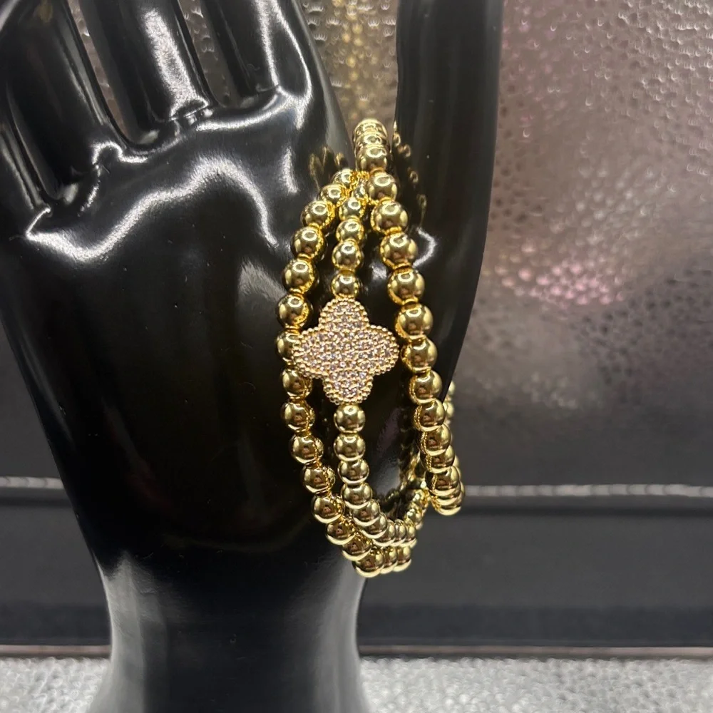 Elegant Gold Beaded Bracelet with Floral Accent